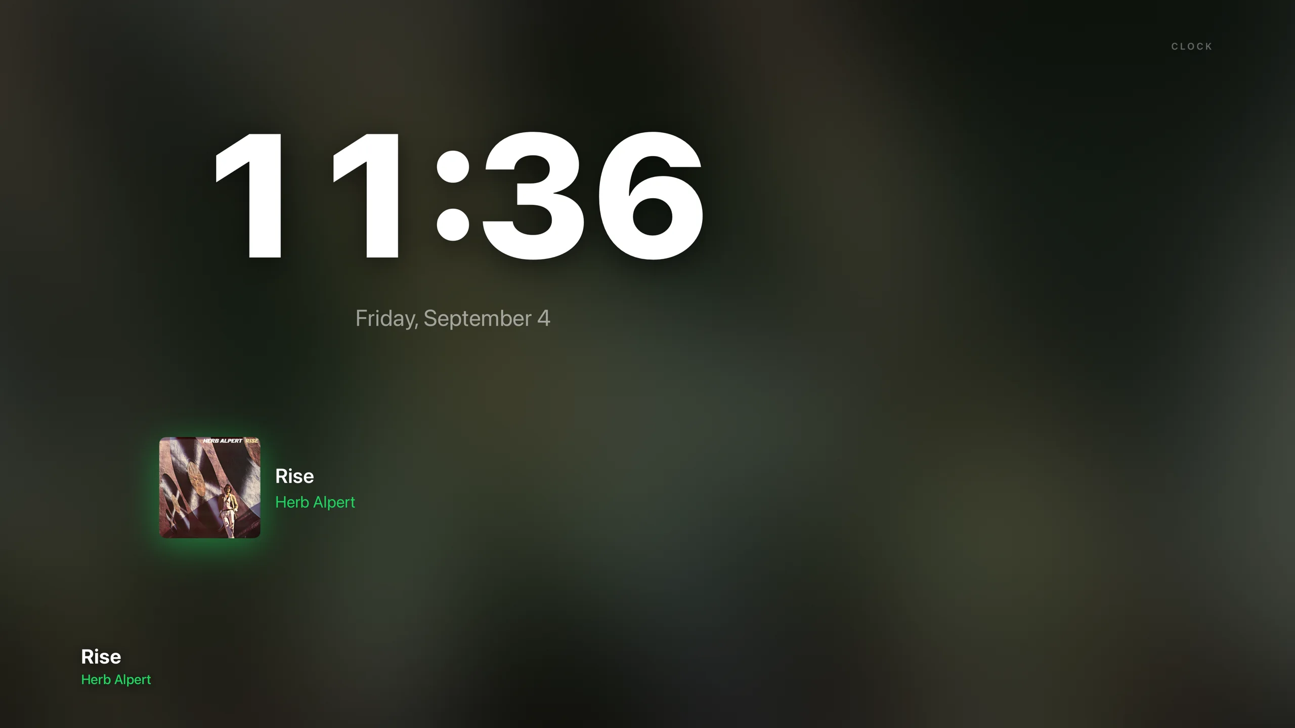 Dial ambient screensaver, clock stage: the time in large type over the album colors