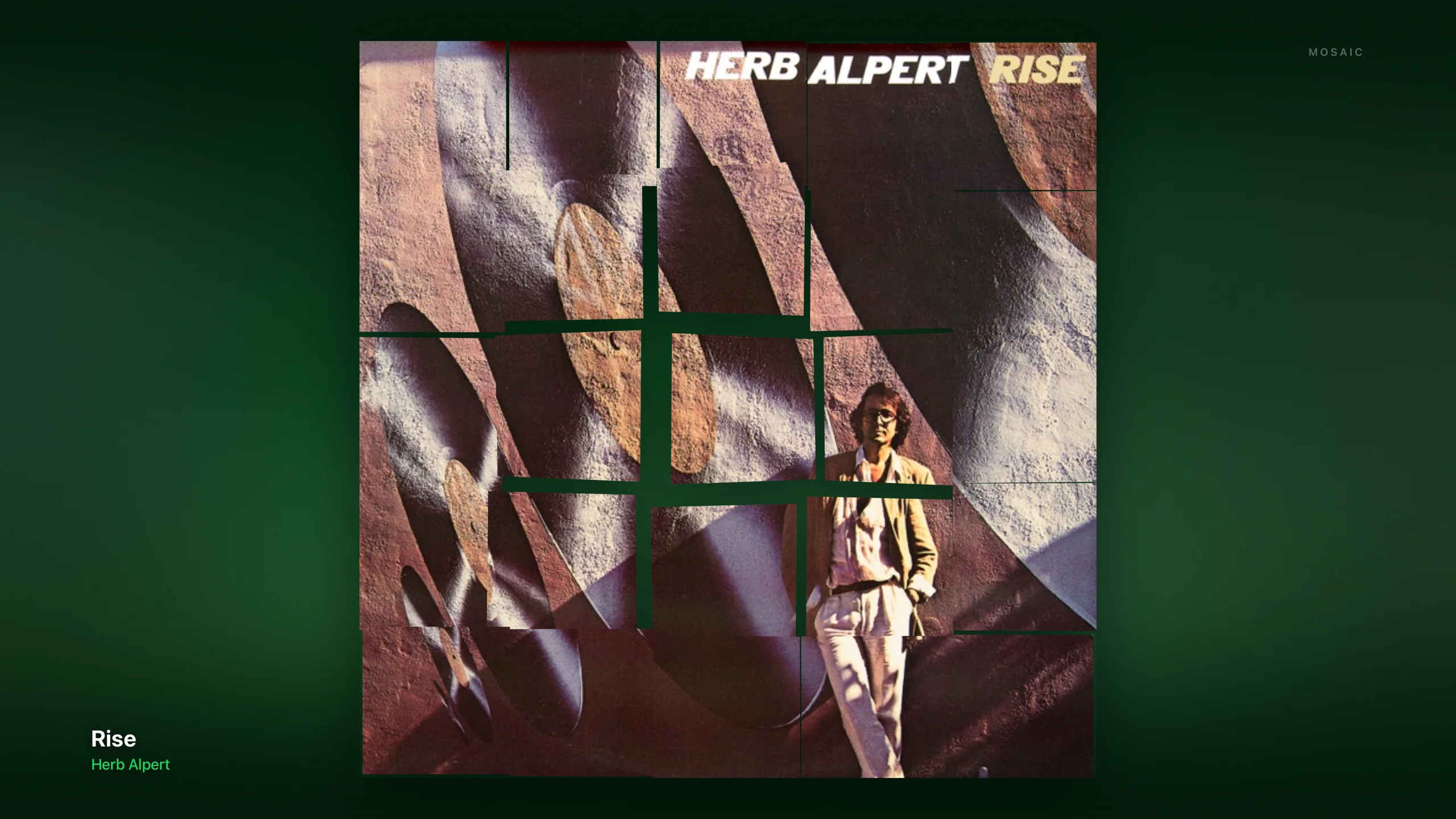 Dial ambient screensaver: the album cover broken into drifting mosaic tiles